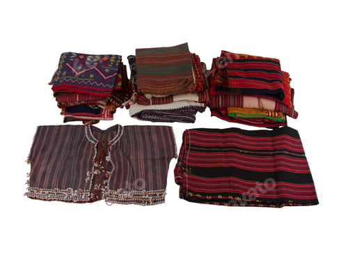 Preview: Closeup of old folded clothes with stripes isolated on a white background