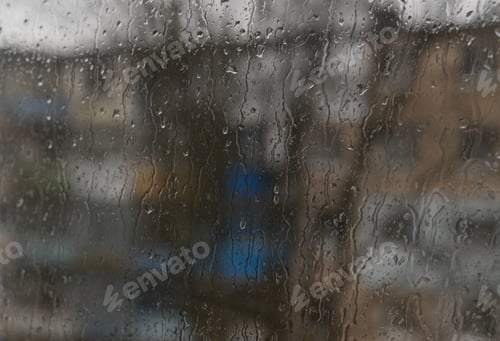Preview: drops on the glass. raindrops on the window on a rainy day