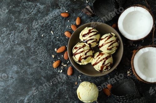 Preview: Bowl with ice cream balls and ingredients on black smokey table