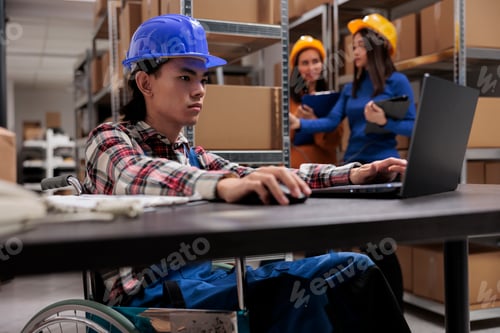 Preview: Retail storehouse employee doing product cataloging on laptop