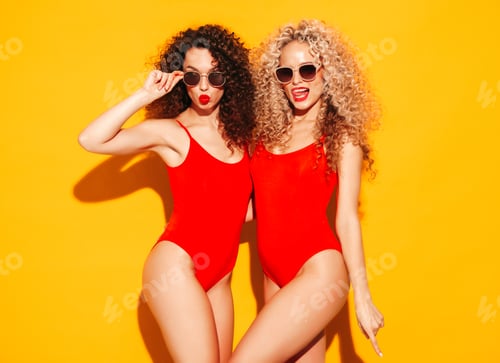 Preview: Two hot beautiful women posing in studio
