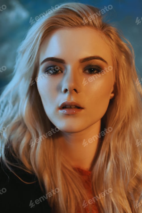 Preview: Portrait Of A Beautiful Blonde With Make-Up Near The Textured Wall