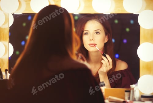 Preview: Portrait of a beautiful woman as applying makeup