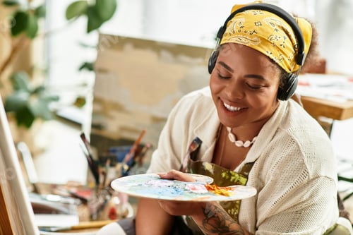 Preview: Creative woman enjoys painting in a vibrant craft workshop during a sunny afternoon