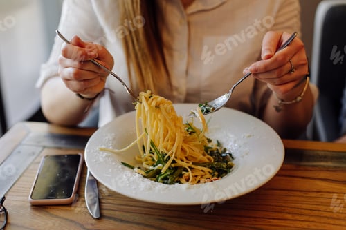 Preview: Friends enjoying lunch in the restaurant, eating paste