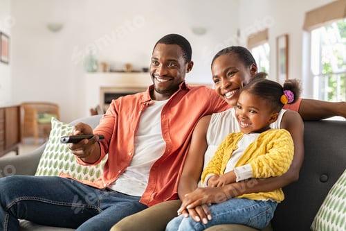Preview: Happy african american family watching TV at home
