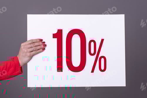 Preview: Female hand holding a 10% poster. Studio shot.