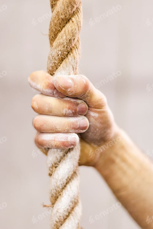 Preview: Man holding rope in gym