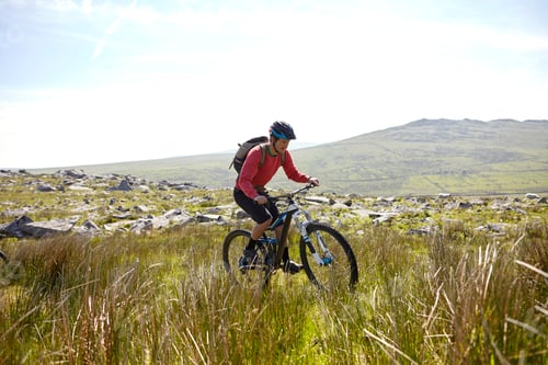 Preview: Cyclist cycling on hillside