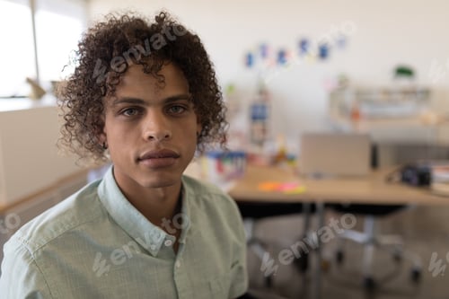 Preview: Confident young man in casual shirt working in modern office environment, copy space