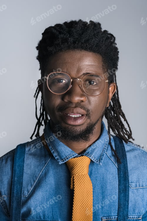 Preview: portrait of handsome african american man in glasses isolated on gray
