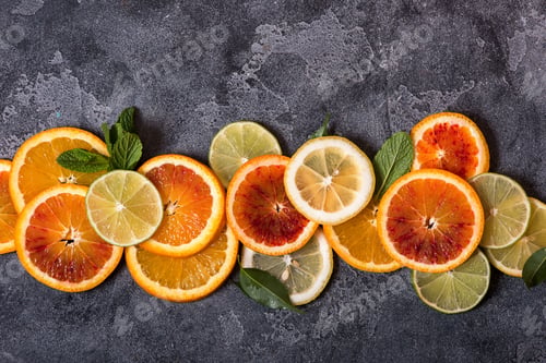 Preview: Colorful Citrus Fruit Slices on a Dark Background