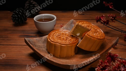 Preview: Traditional mooncakes on wooden plate, for Chinese mid Autumn festival celebration.