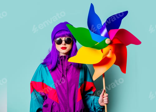 Preview: Stylish white girl with purple hair and 80s tracksuit hold pinwheel on blue background