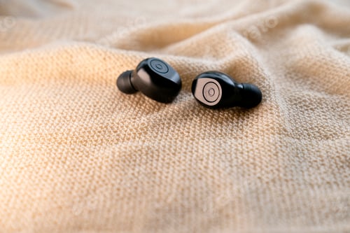 Preview: A pair of wireless headsets on natural background