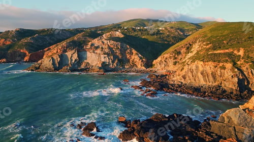 Preview: Coastal hills ocean swell at summer drone view. Turquoise waves washing stones
