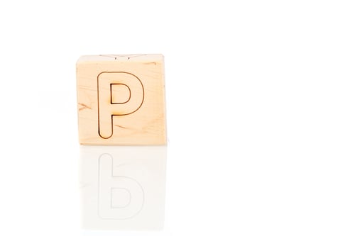 Vista previa: Wooden cubes with letters P on a white background