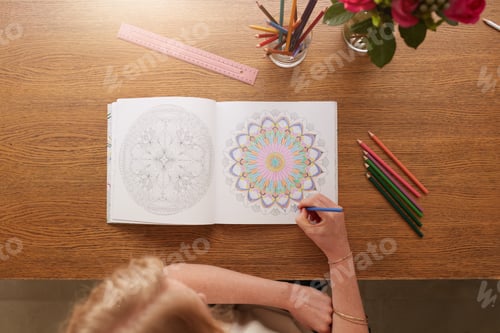Preview: Woman drawing in adult colouring book