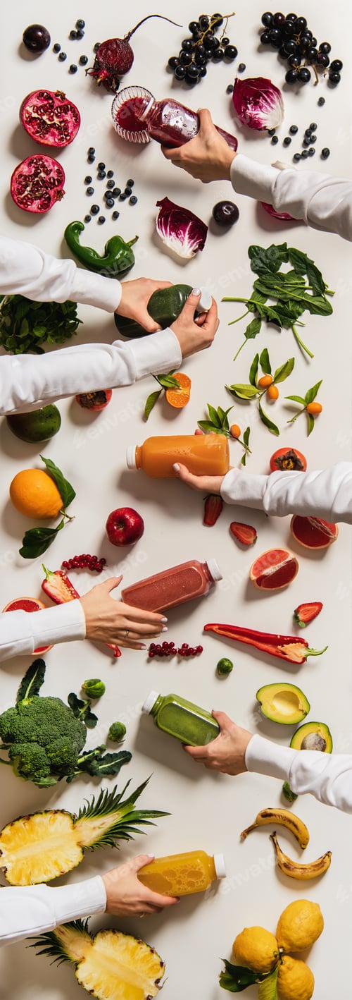 Preview: Flat-lay of human hands keeping bottles with fresh juices
