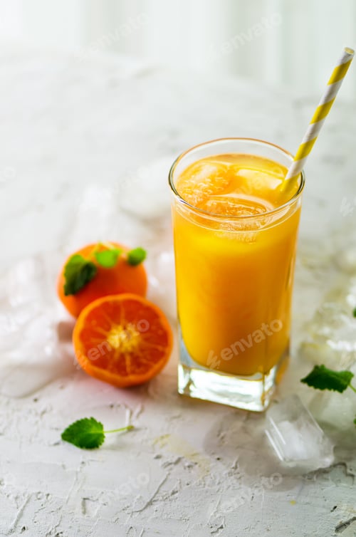 Preview: Orange juice with ice and tangerines on white background. Free space for your text. Copyspace. Cold