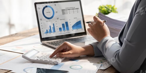 Preview: Business woman using calculator to calculate financial report, working at office with laptop