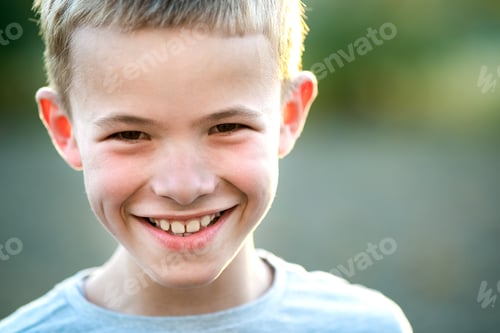 Preview: Portrait of a child boy outdoors on a warm sunny summer day