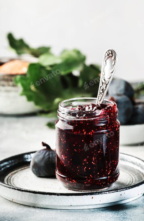 Preview: Fig jam in glass jar with fresh blue figs. Homemade preparations and canning
