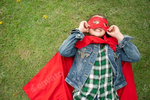 Preview: On a beautiful day in the park, a young girl enjoys her vacation. Playful with a red superhero