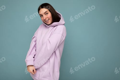 Preview: Young cute sttractive brunette woman with sincere emotions isolated on background wall with copy