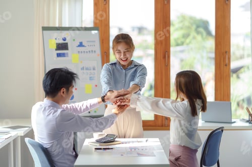 Preview: Young Asian business people working as a team meeting and work together on new project emphasizing