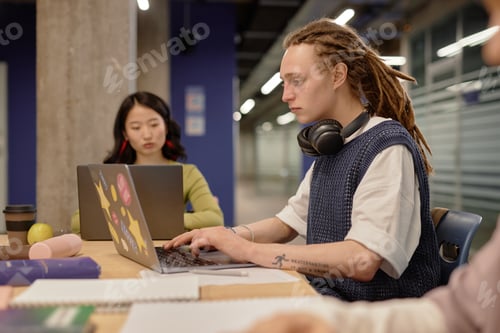 Preview: Male University Student Using Computer in Class