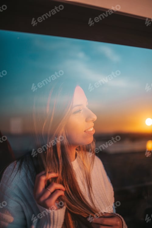 Preview: Young woman behind a window