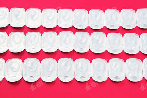 Preview: Some blister pack of daily contact lenses. Contact lens in disposable plastic containers.