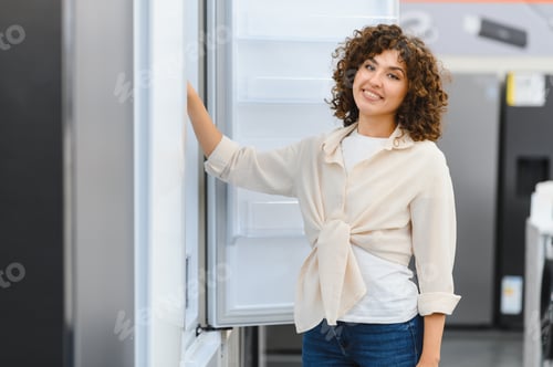 Preview: Customer choosing refrigerator in electronics store