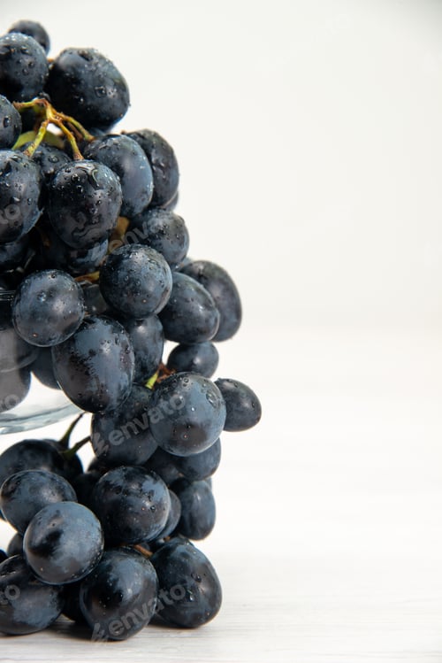 Preview: front close view fresh black grapes juicy mellow fruits on white desk fruit fresh mellow juice