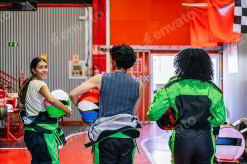 Preview: Friends at Go Kart Racing Venue Hold Helmets