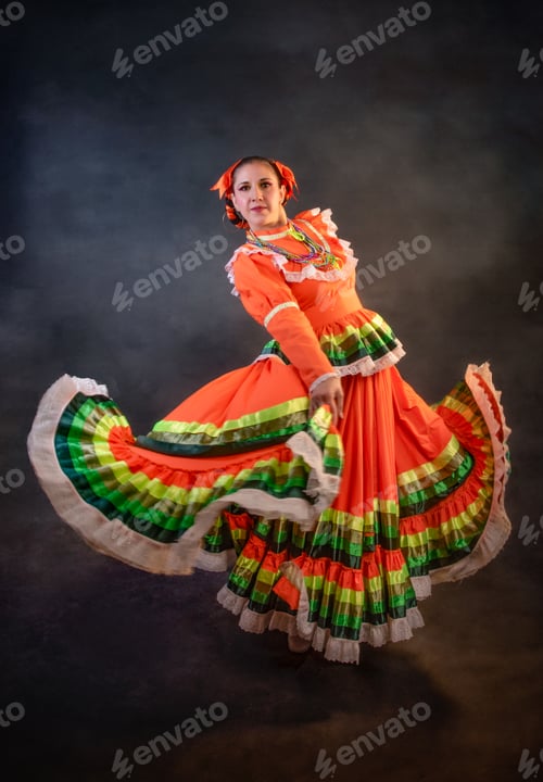 Preview: A woman in a colorful dress is dancing