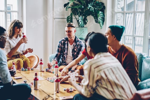 Preview: Young people making bets during poker game