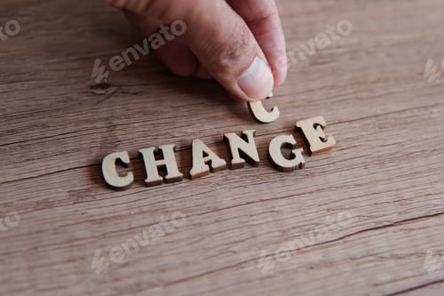 Preview: Hand changing the word Change into Chance.