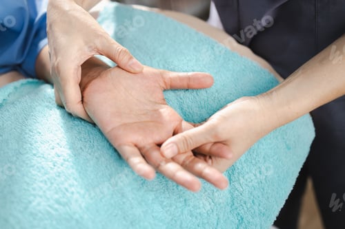 Preview: Physical therapy, skilled practitioner provides physical therapy by gently manipulating hand