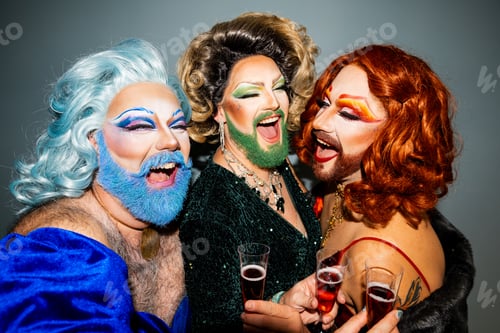 Preview: Three drag queens celebrating in style with toasting wine glasses