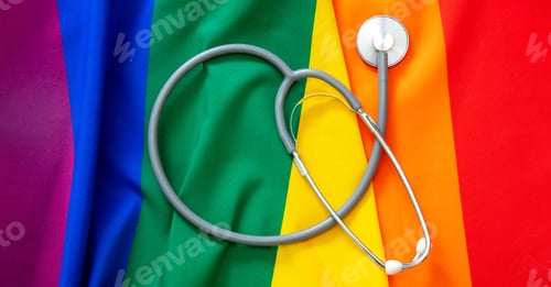 Preview: LGBT Health care. Medical Stethoscope on rainbow pride flag background, overhead view