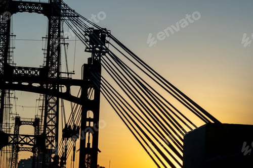 Preview: Silhouette shot of lifting crane with cable wires in Santa Fe, Argentina