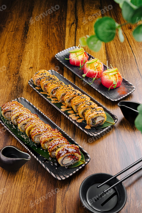 Preview: Sushi rolls and appetizers served on elegant plates in a warm setting