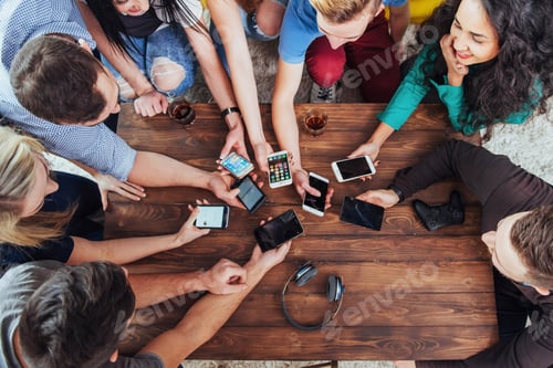 Preview: Top view hands circle using phone in cafe - Multiracial friends