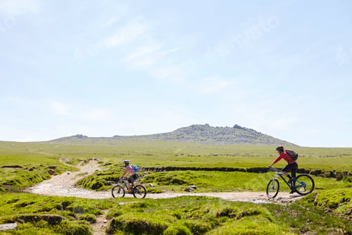 Preview: Cyclists cycling on hillside path