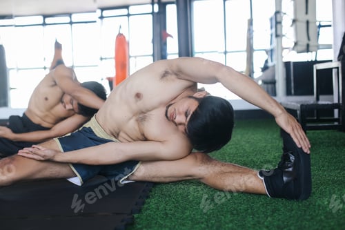 Preview: Boxer Man Stretching Together With Holding Foot