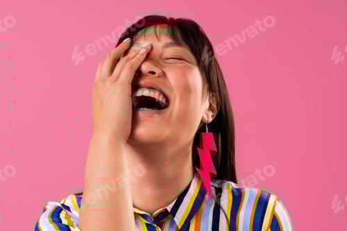 Preview: Beautiful asian woman portrait, young asian woman laughing covering face having fun