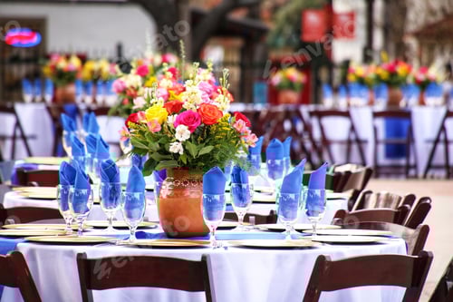 Preview: Beautiful table setting at an outdoor wedding venue.