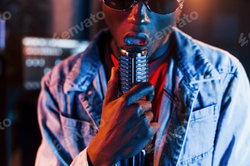 Preview: Young african american performer rehearsing in a recording studio